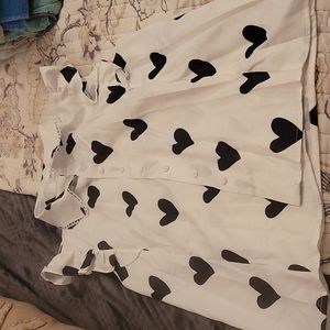 Heart print button up top. Never worn.